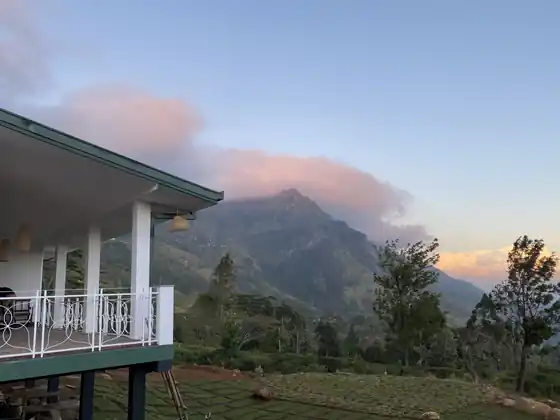 Sunset clouds over the mountain seen from the Library Suite's railed veranda